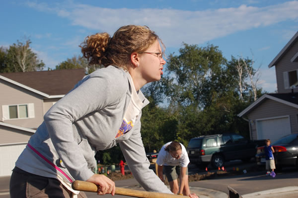 Gina Palmer, a special education major, listens to the construction manager's orders